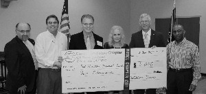 Joining together at the January luncheon are (l-r) Benjamin Garcia, Marty Paulsen, Witzel, Mrs. Wickstrom (wife of the late Paul Wickstrom), Capt. David H. Grundies, USN (Ret.), and Gerald Hampton.